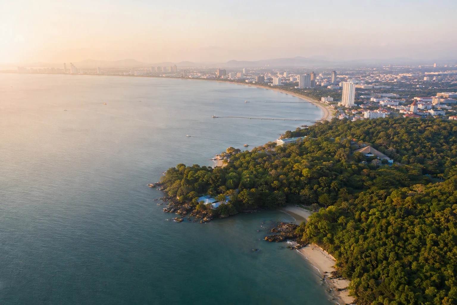 Pattaya coastline and green headland in morning light