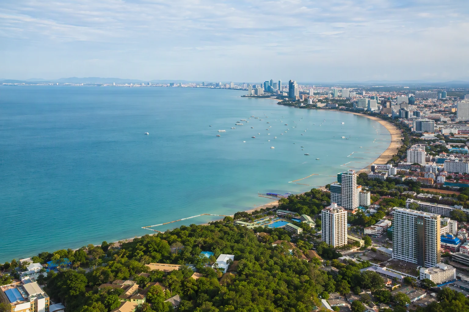 aerial view of a sweeping Pattaya coastal bay